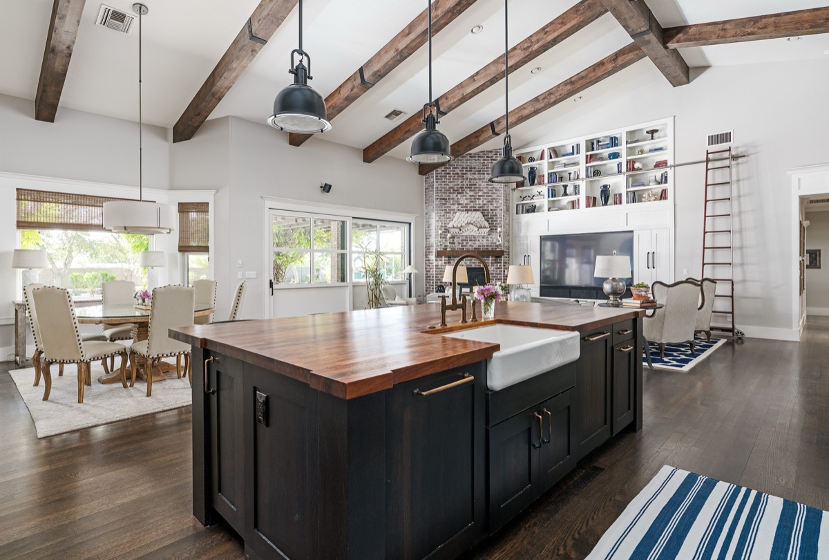 Farmhouse kitchen with an apron sink and exposed beams