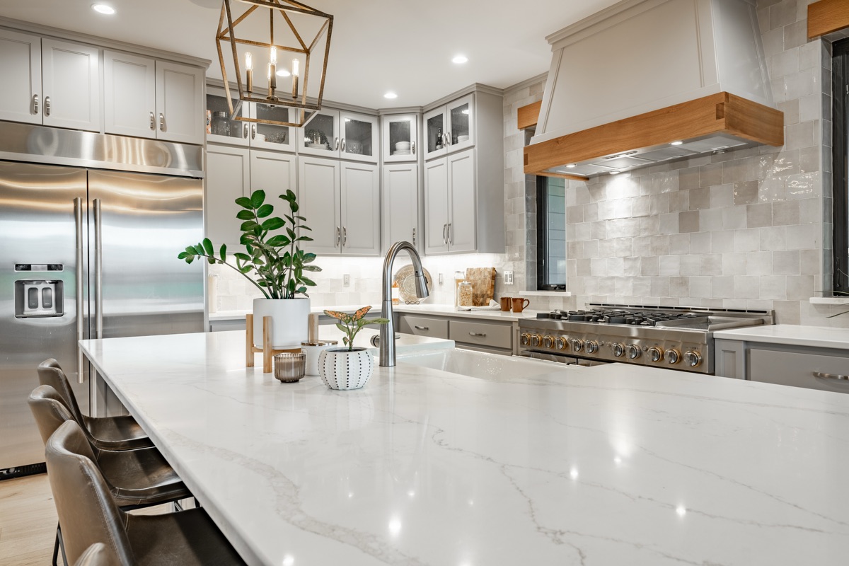 Transitional kitchen with white shaker cabinets